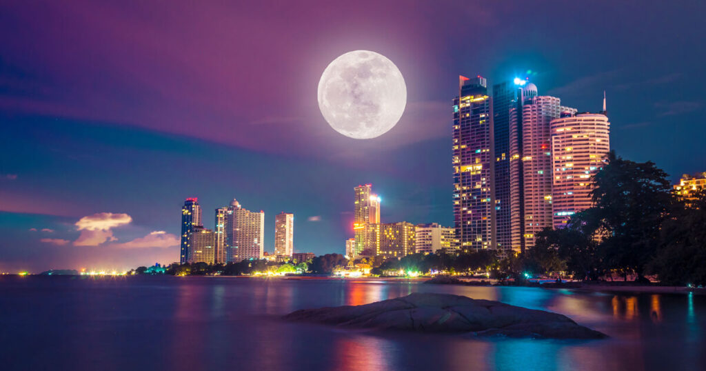 night view of Pattaya city, Pattaya buildings, moon on city.