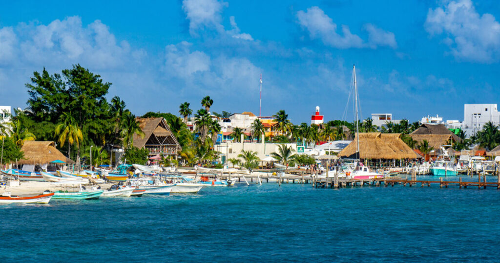 Mexico island view, water boats, best island in Mexico, safest places to travel in Mexico.