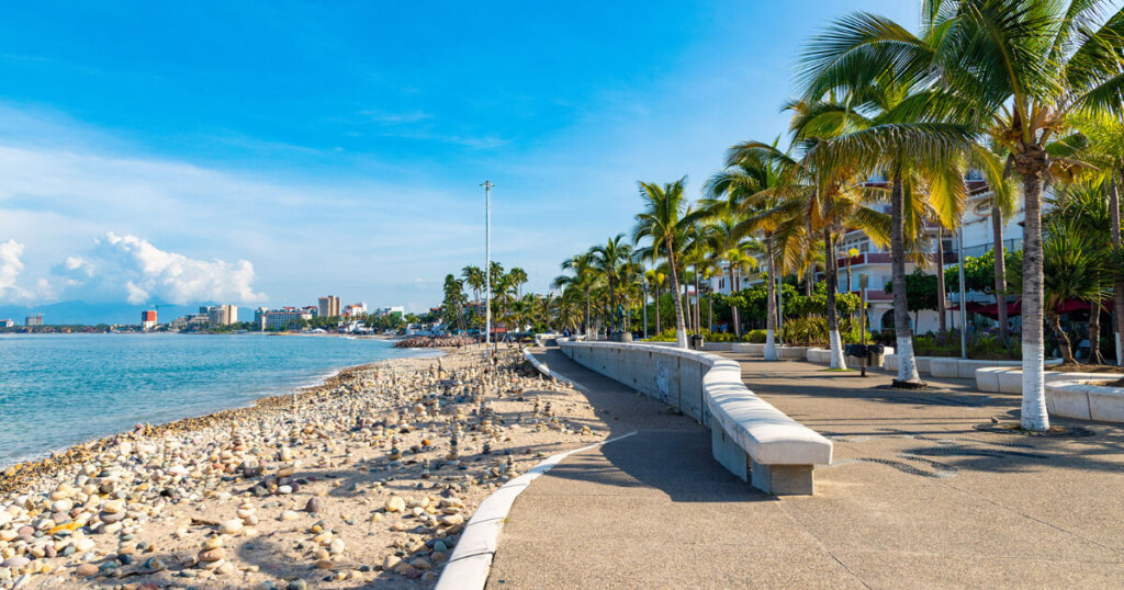 blue water, sit near beach, sit under coconut trees, Puerto Vallarta town view, safest places to travel in Mexico.