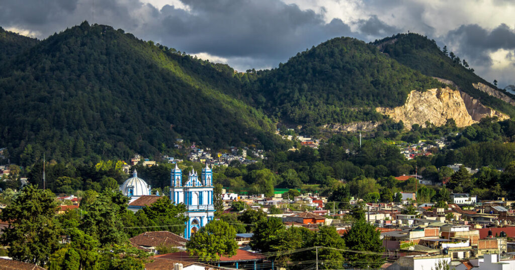 Mexico church, Mexico village, lush green mountains, San Cristobal de las Casas town view.