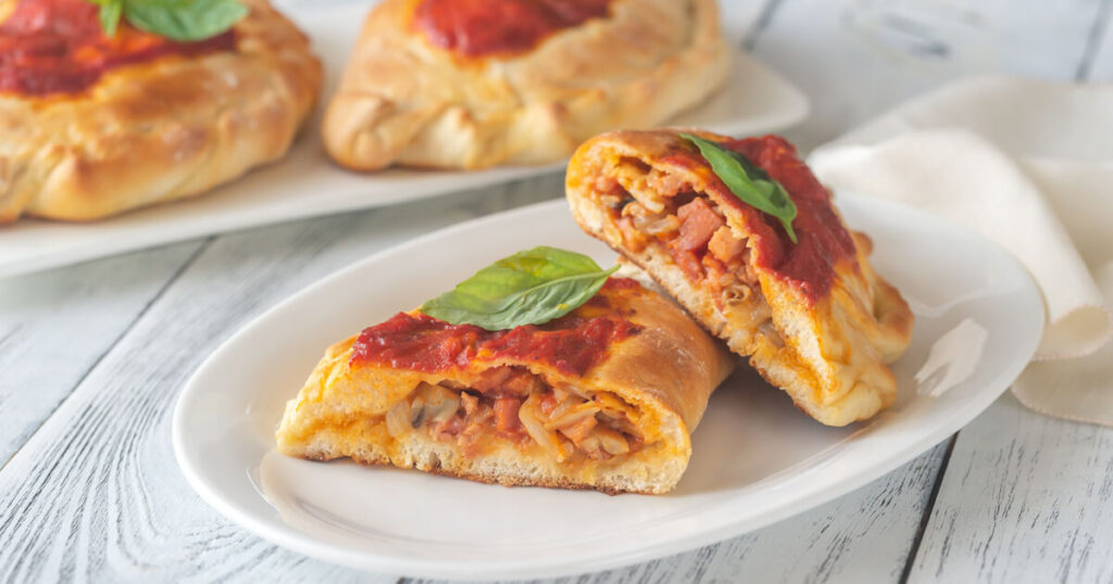 calzone, Italian savory dish, the best street foods in Italy.